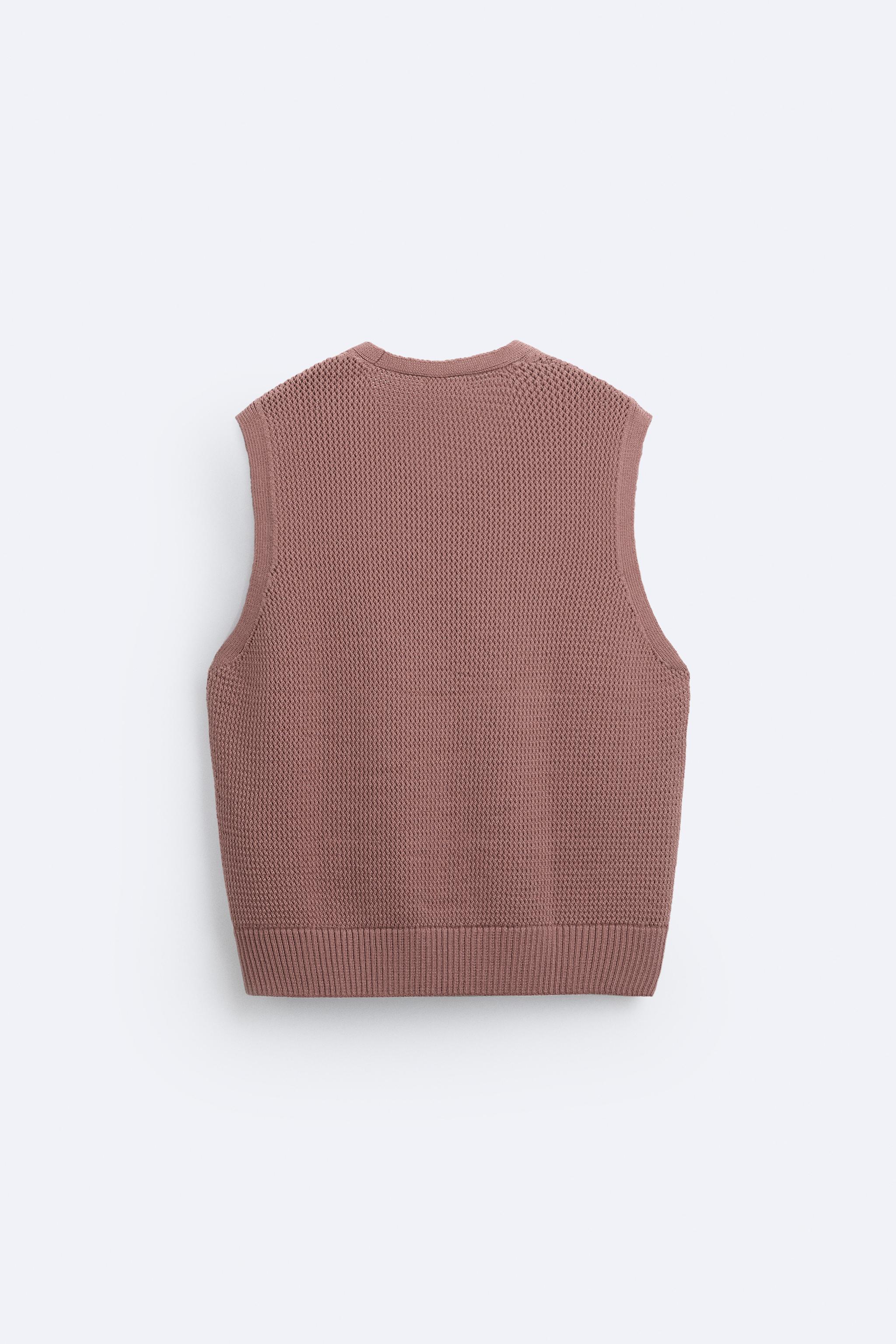 Knit vest in a cotton blend. Sleeveless with V-neckline. Rib trim. Product Image