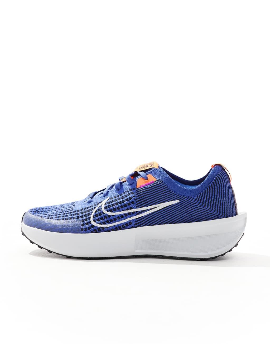 Nike Running Interact Run sneakers in blue and white Product Image