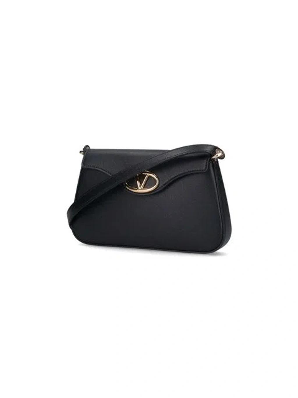 VALENTINO GARAVANI Valentino Logo Plaque Foldover Top Shoulder Bag In Black Product Image