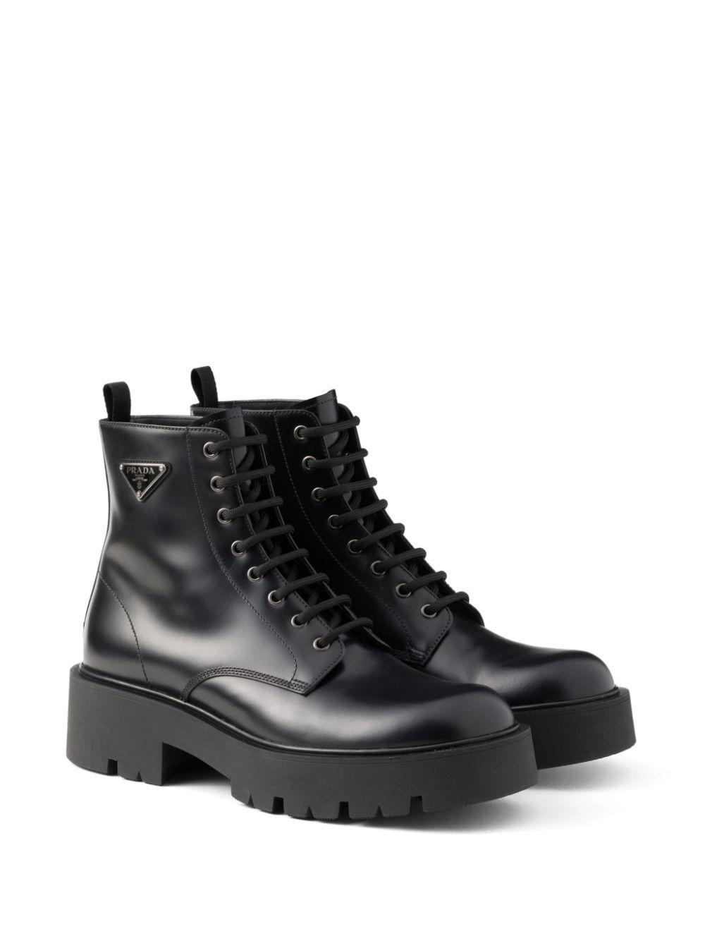 PRADA Logo Plaque Leather Combat Boots In Black Product Image