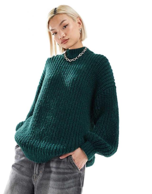 Monki high neck chunky rib knitted sweater with volume sleeve in dark green Product Image