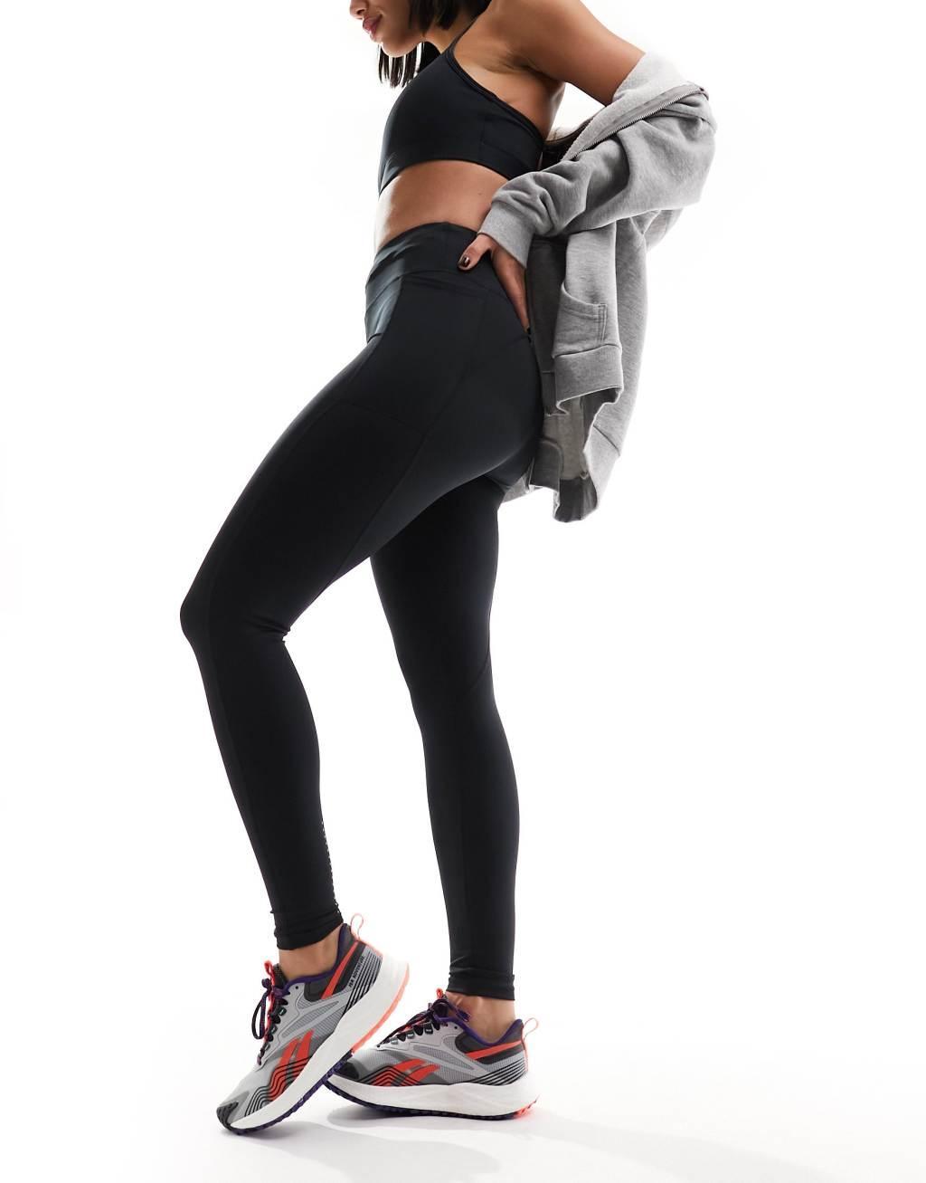 ASOS 4505 CurveIcon running tie waist gym leggings with phone pocket in navy Product Image