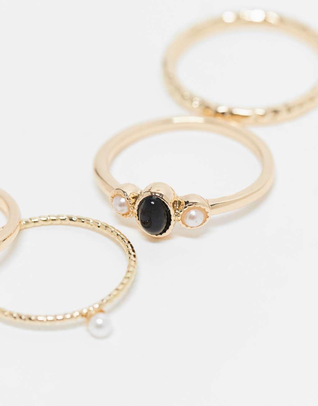 ASOS DESIGN Curve pack of 5 rings with black stone and faux pearl design in gold tone Product Image