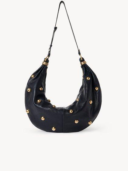 Large Bracelet hobo bag in grained leather with studs Product Image