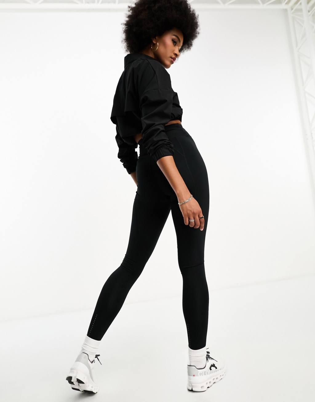 ASOS 4505 CurveIcon running tie waist gym leggings with phone pocket in navy Product Image