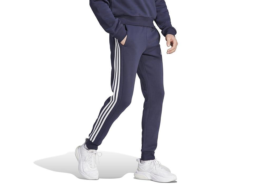 adidas Essentials Fleece Tapered Cuffed 3-Stripes Pants (Ink) Men's Clothing Product Image