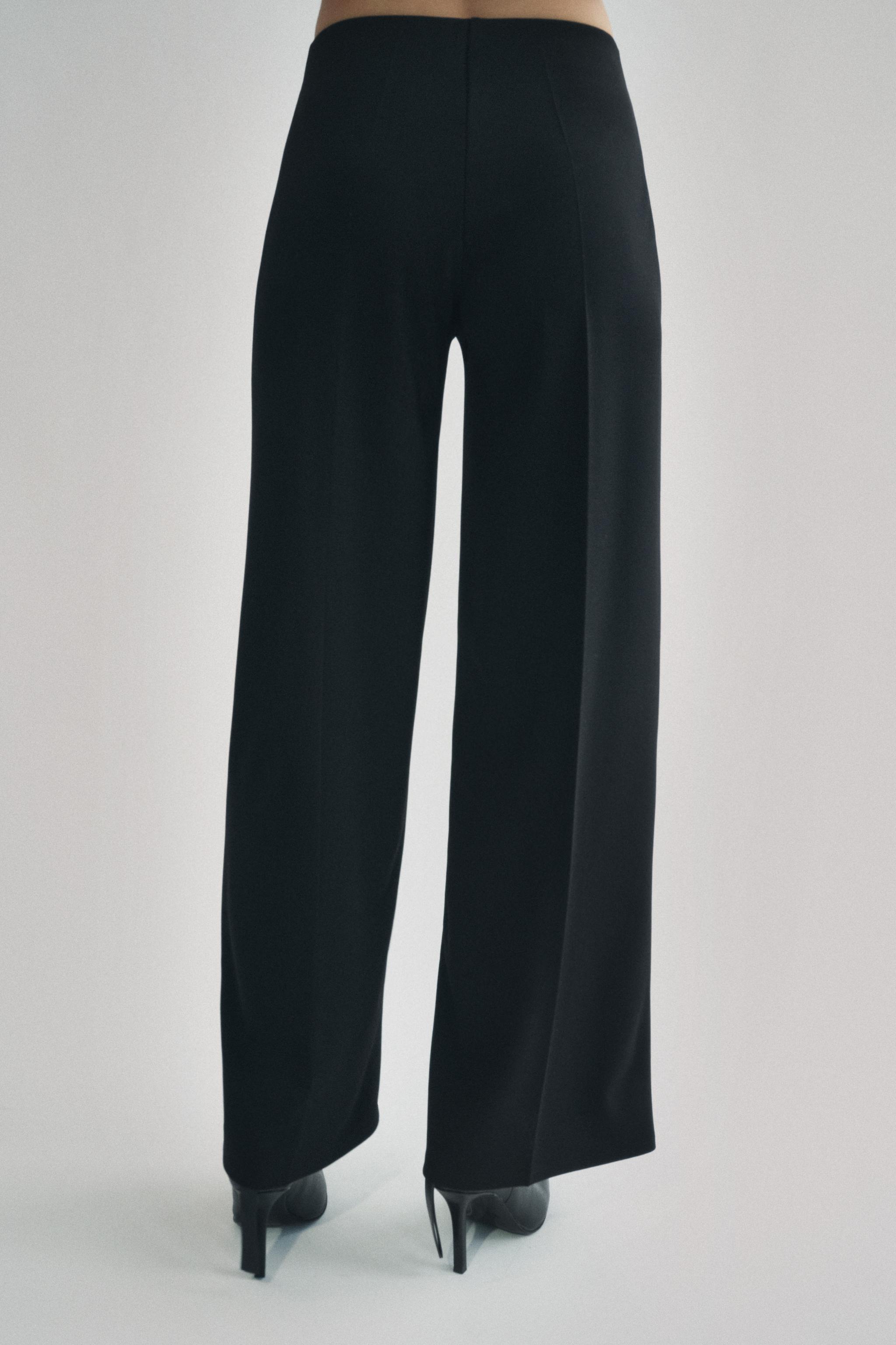 Wide leg pants with a high waist. Hidden zip closure at side. Product Image