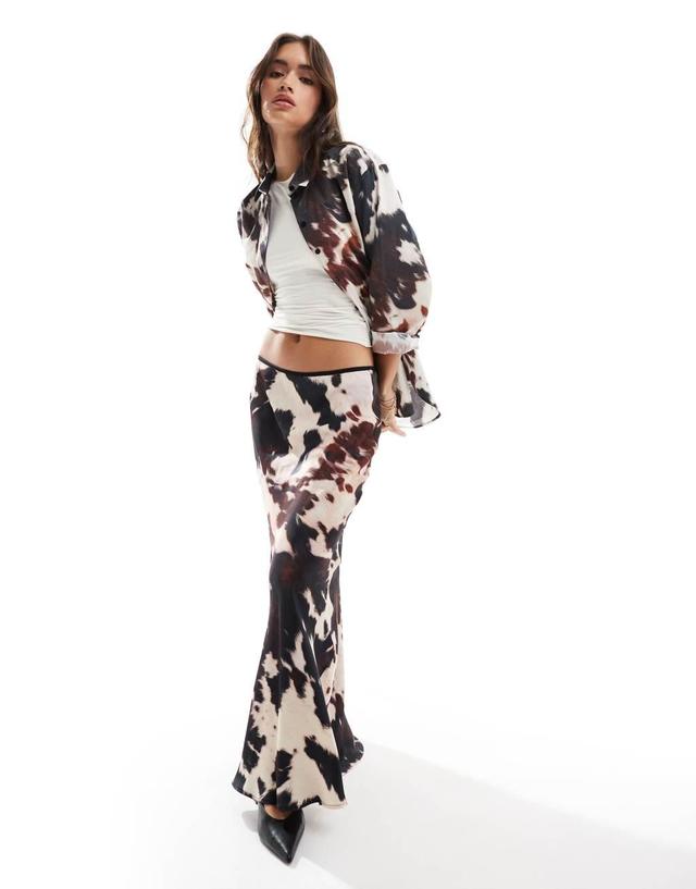 ASOS DESIGN satin bias maxi skirt in cow print Product Image