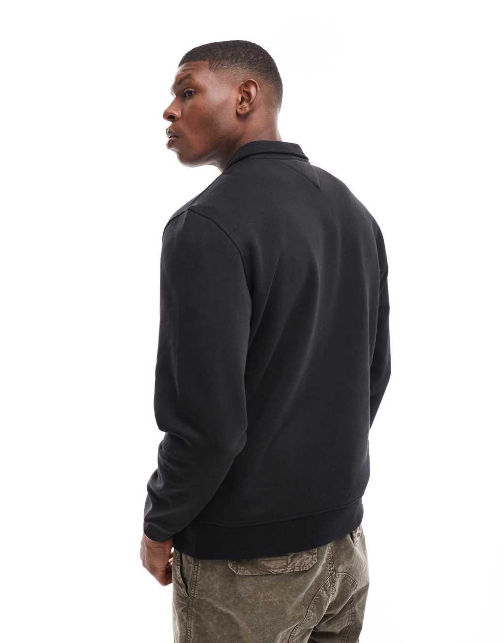 Tommy Jeans 1/4 zip sweatshirt in black Product Image