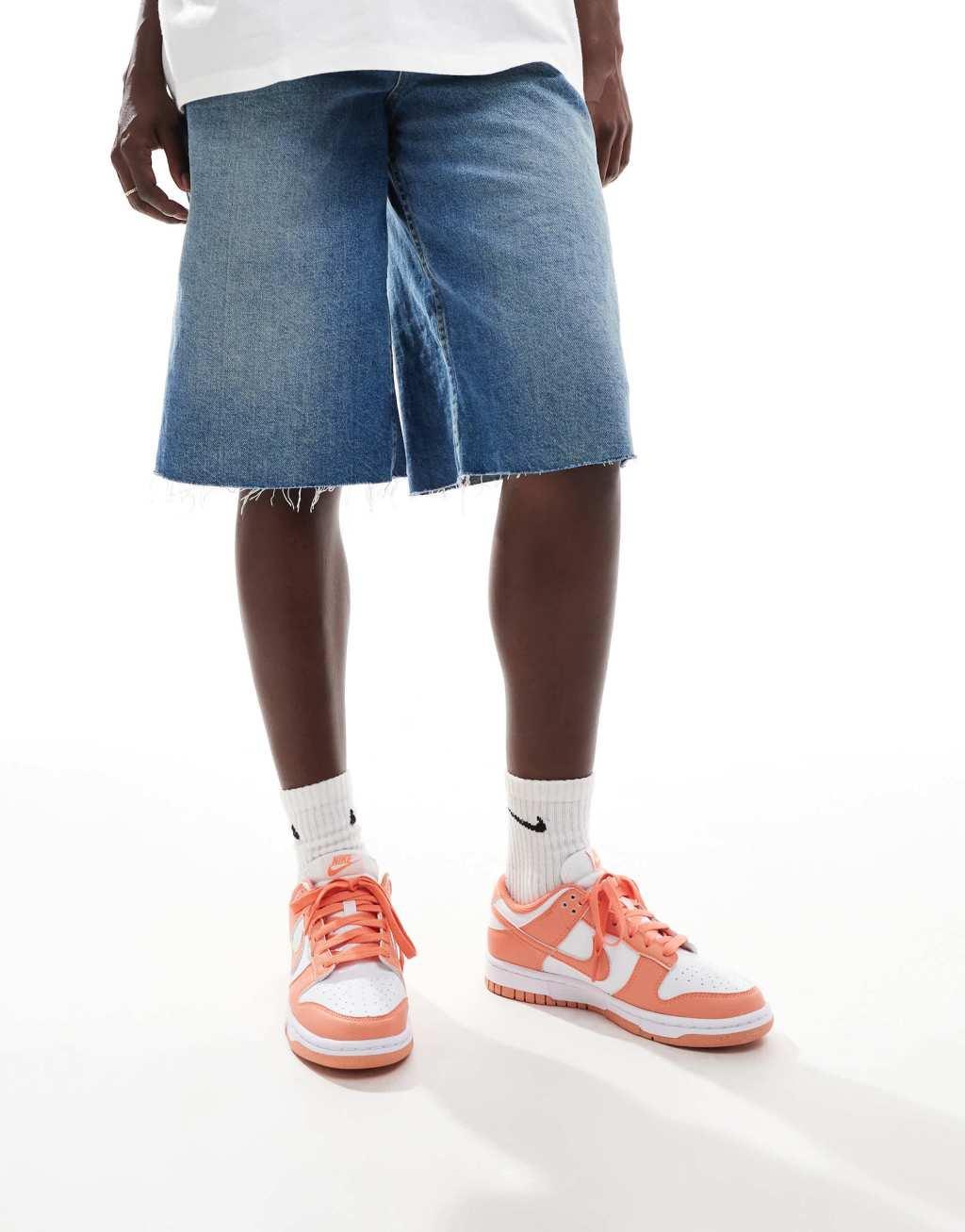 Nike Dunk Low sneakers in white and orange Product Image