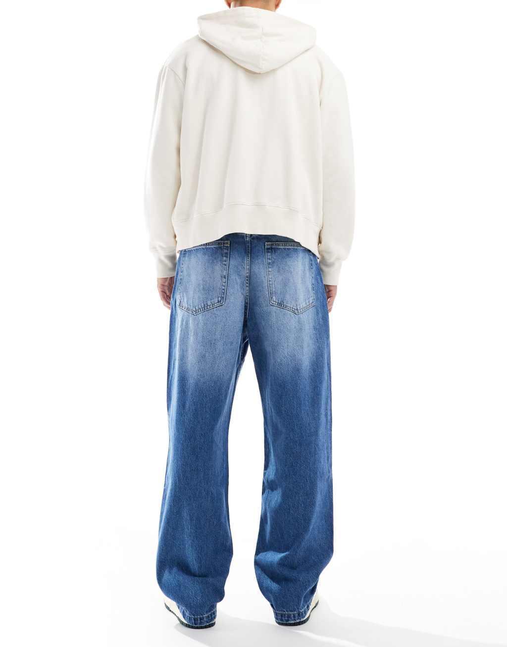 Bershka baggy jeans in mid blue Product Image