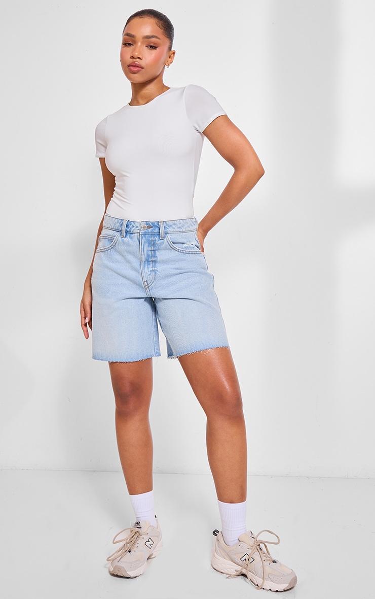 PRETTYLITTLETHING Light Blue Wash Raw Hem Longline Loose Fit Denim Shorts product image