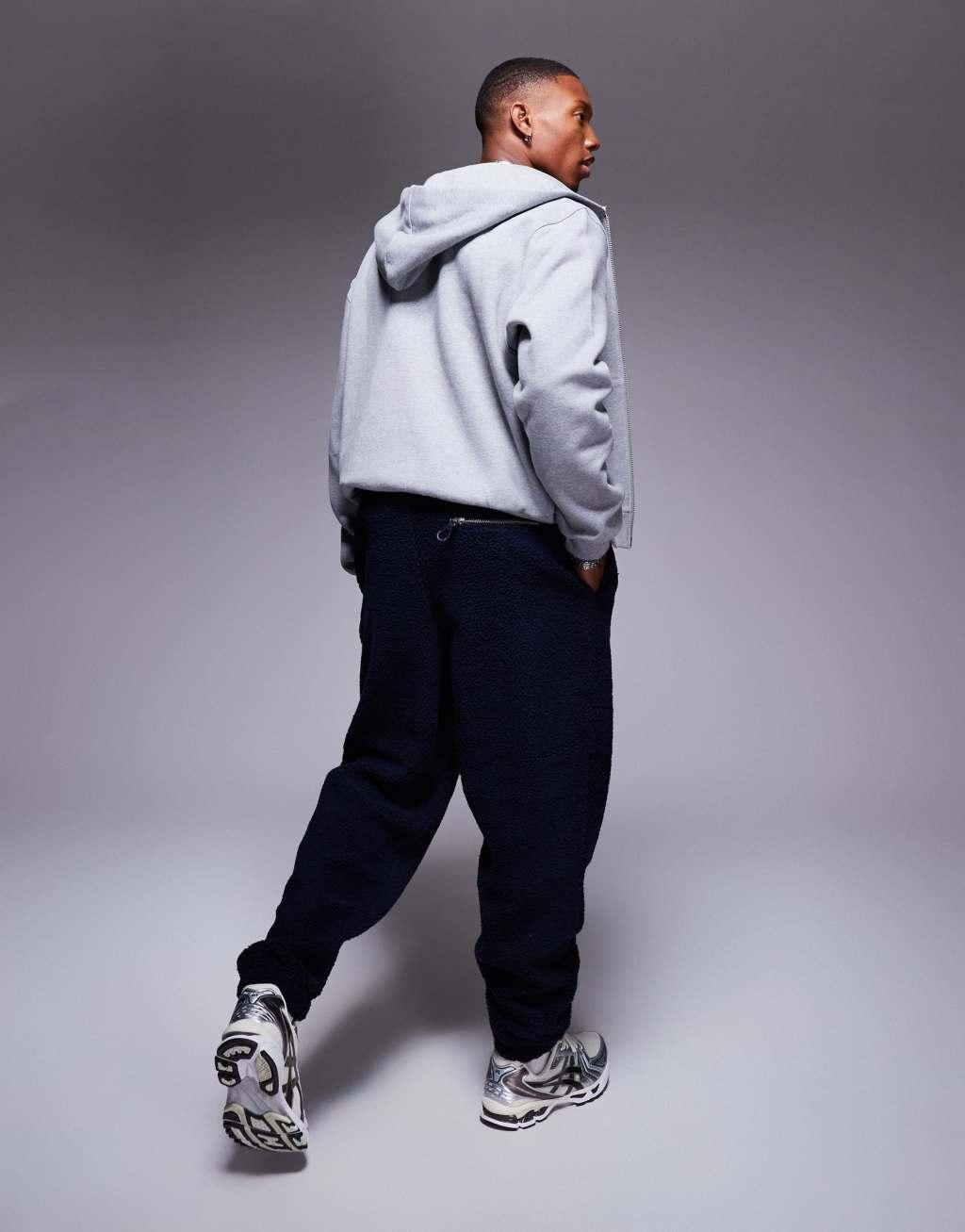 ASOS DESIGN oversized borg sweatpants in navy Product Image