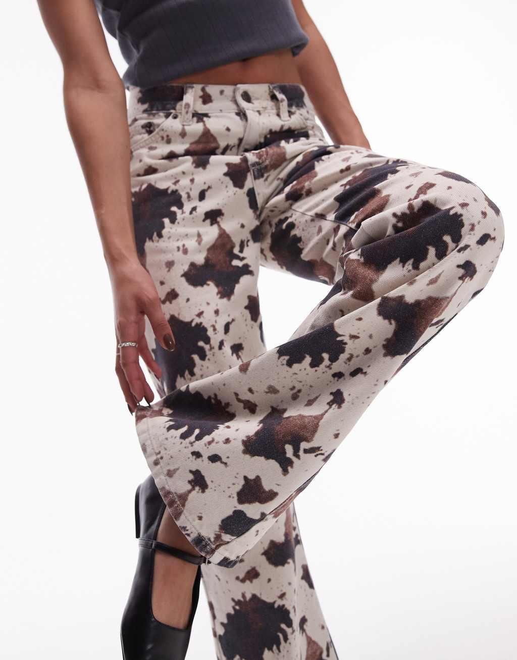 Topshop mid rise 90s flare jeans in cow print Product Image