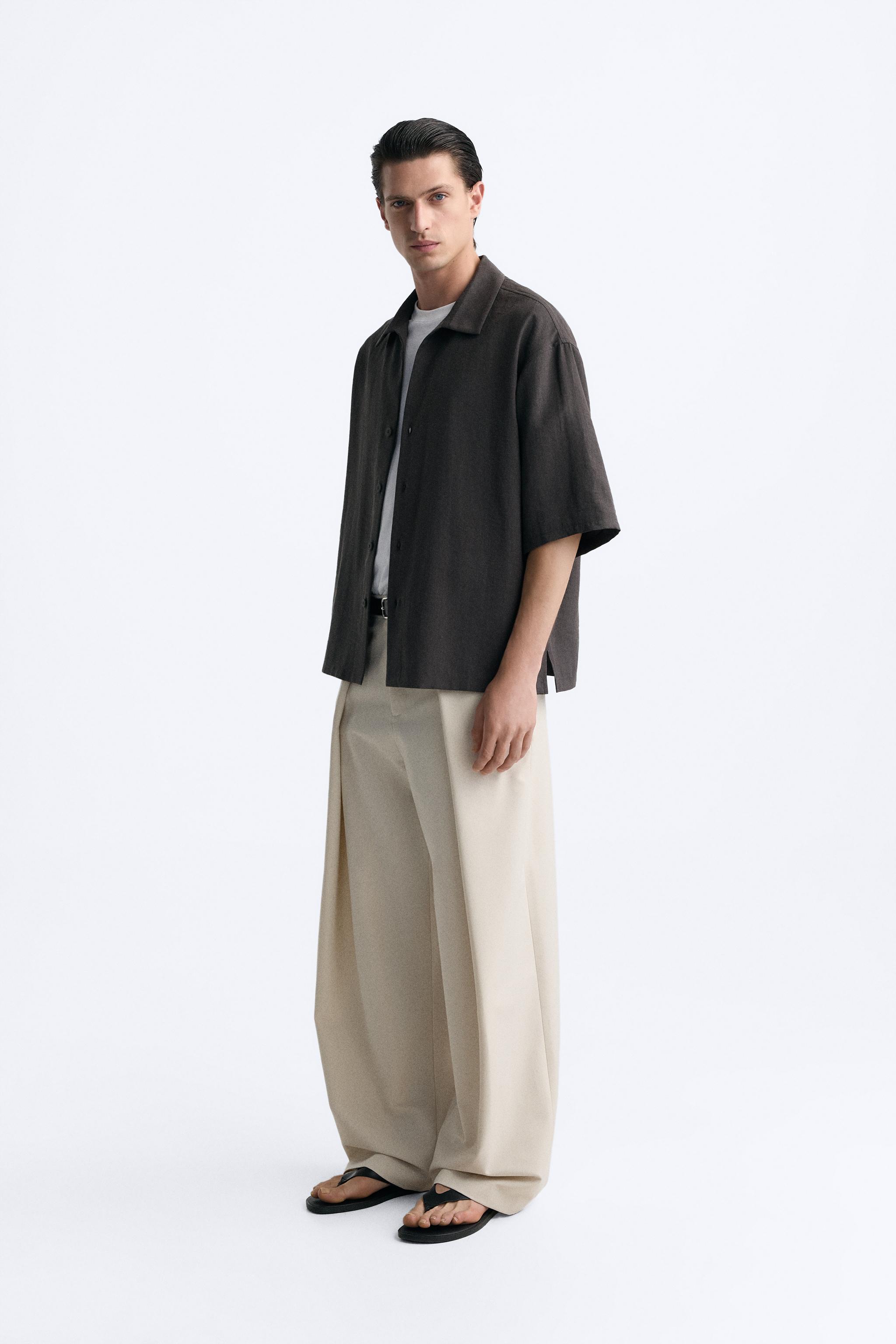 PLEATED WIDE FIT PANTS Product Image