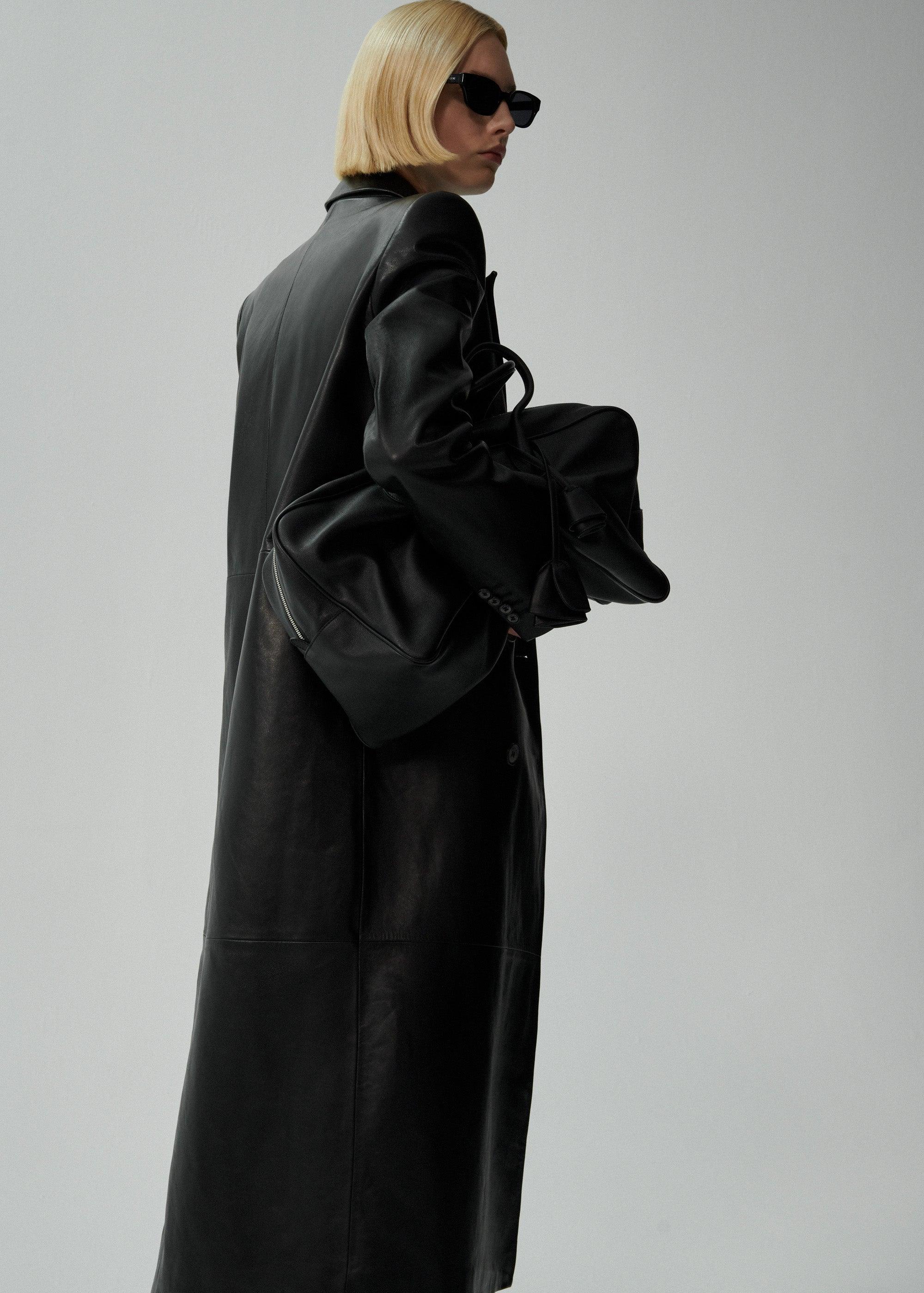 Double-breasted leather coat in black Product Image