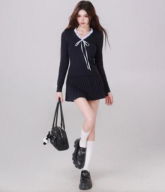 Set: Long-Sleeve V-Neck Bow Knit Top + Mid Rise Plain Mini Pleated Skirt Product Image