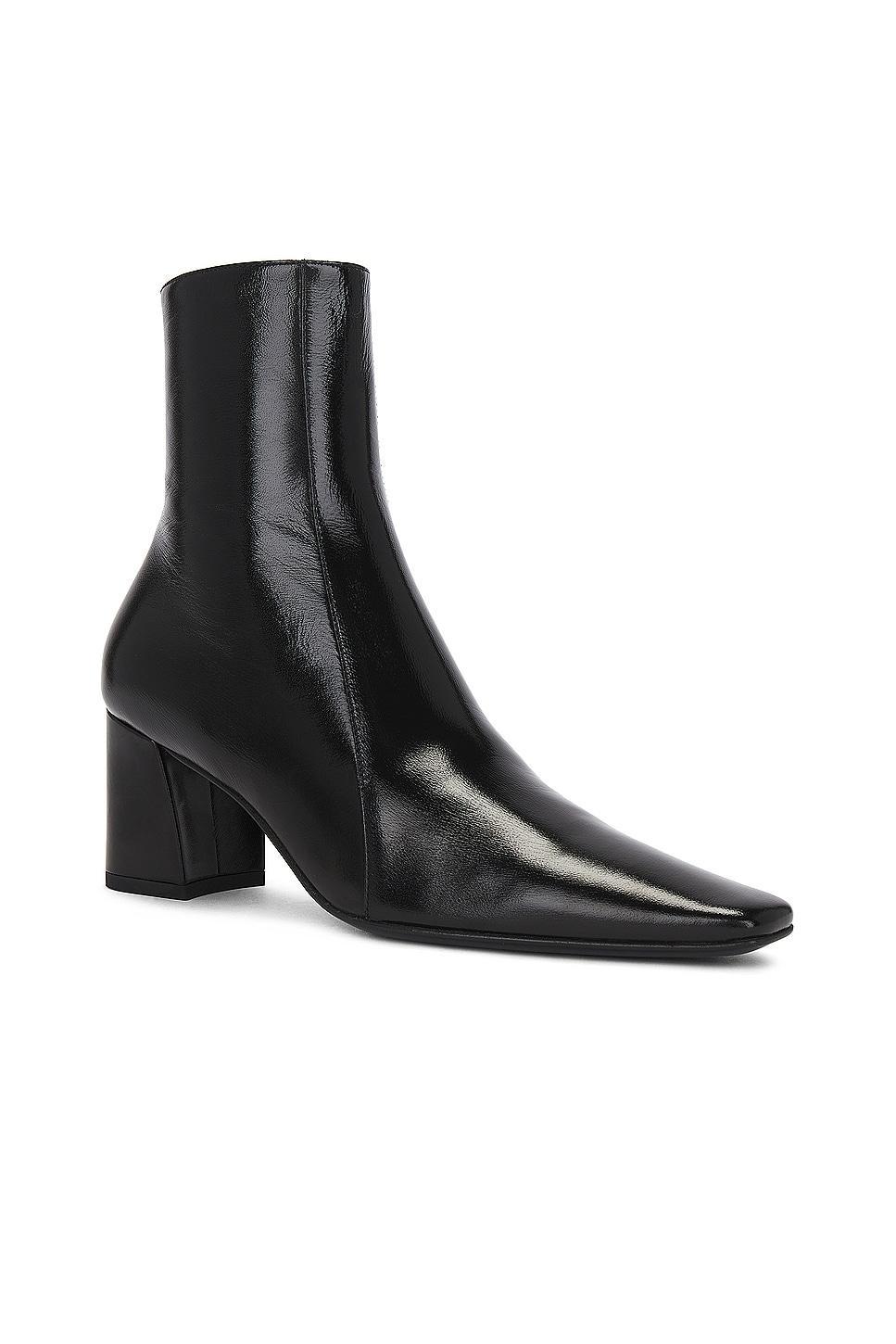 Saint Laurent Rainer Zipped Bootie in Noir - Black. Size 42 (also in 36, 37.5, 38, 40). Product Image