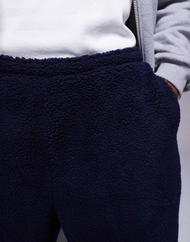 ASOS DESIGN oversized borg sweatpants in navy Product Image