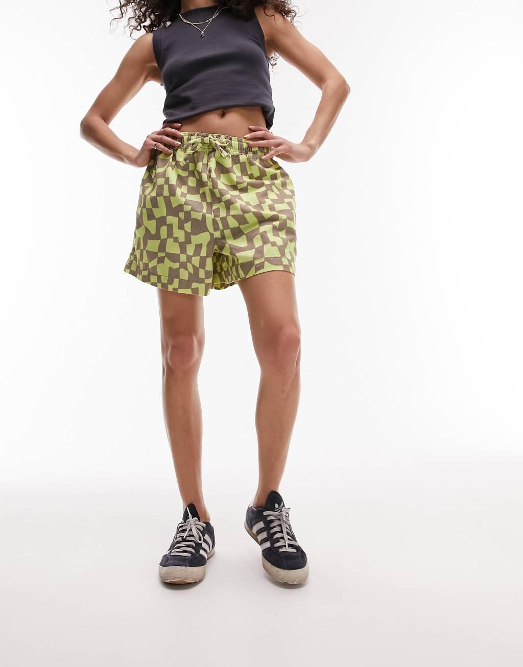 Topshop abstract checkered print runner shorts in green Product Image