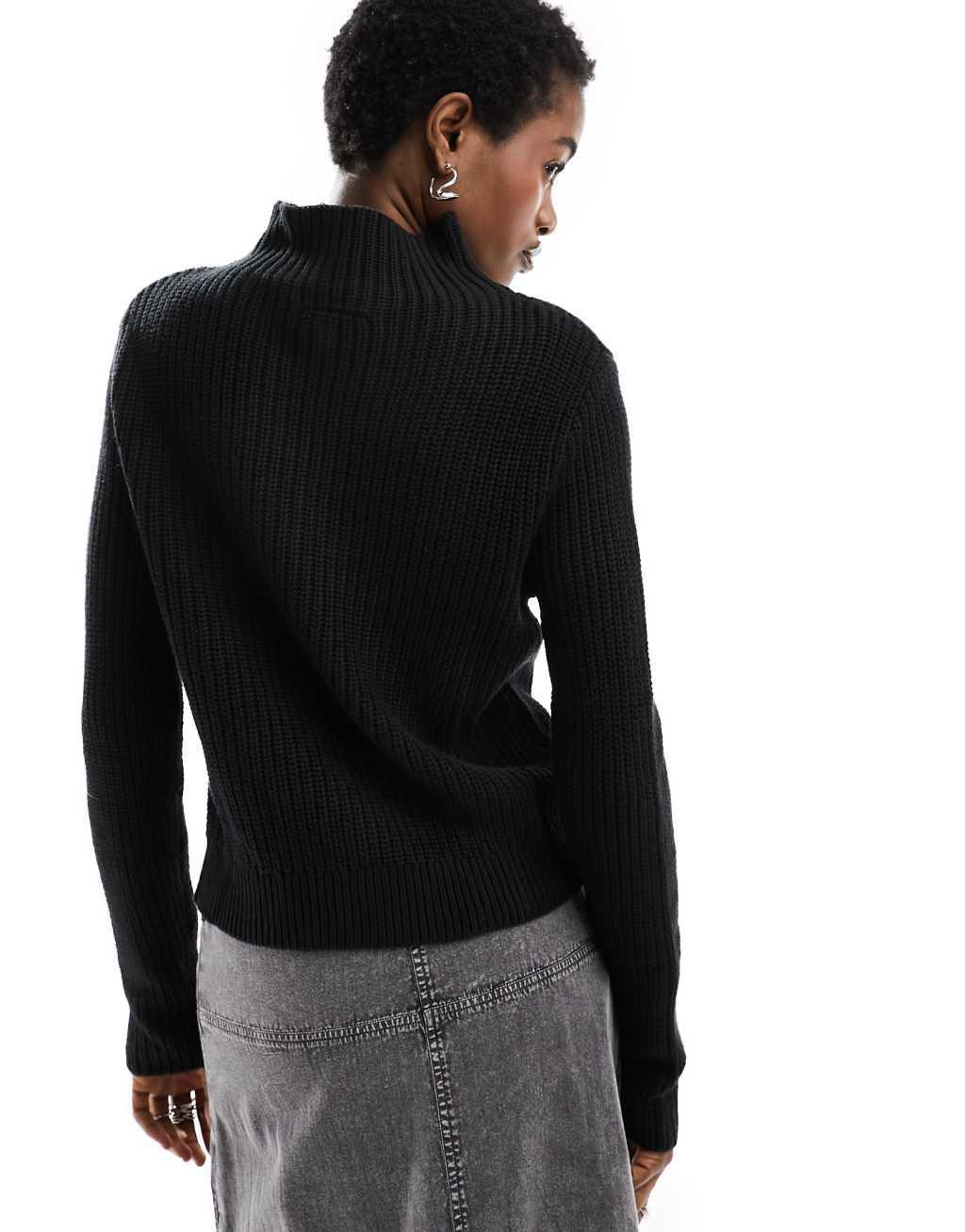 Monki knit turtleneck long sleeve sweater in black Product Image