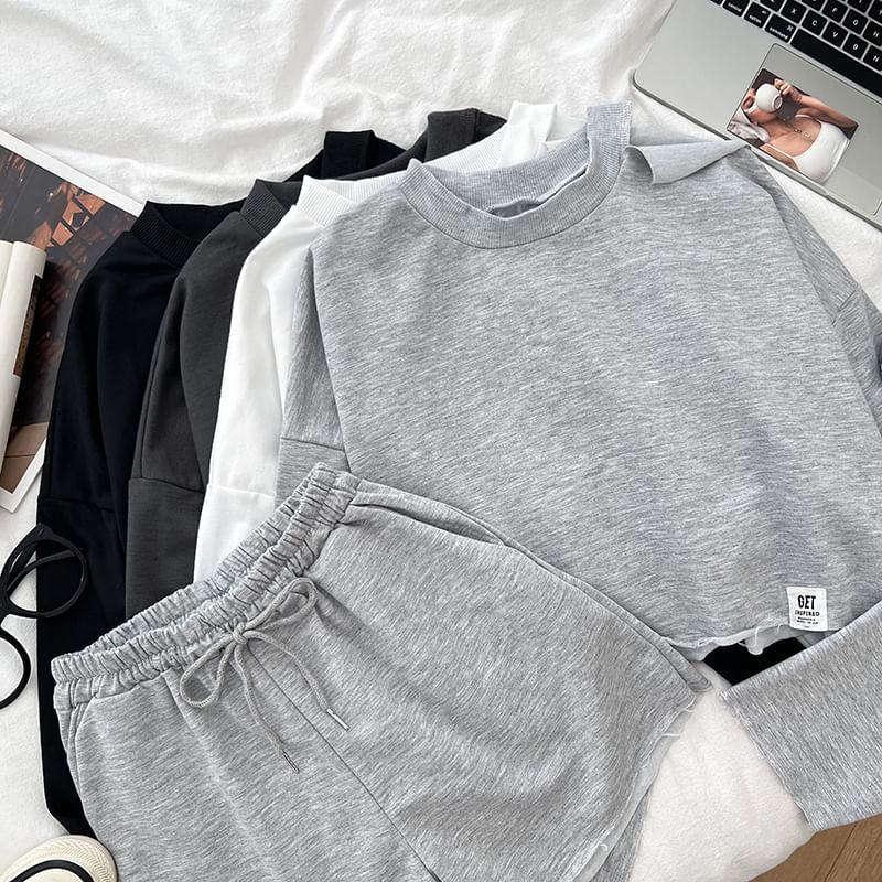 Set: Long-Sleeve Crew Neck Plain Crop T-Shirt + Drawstring Plain Shorts Product Image