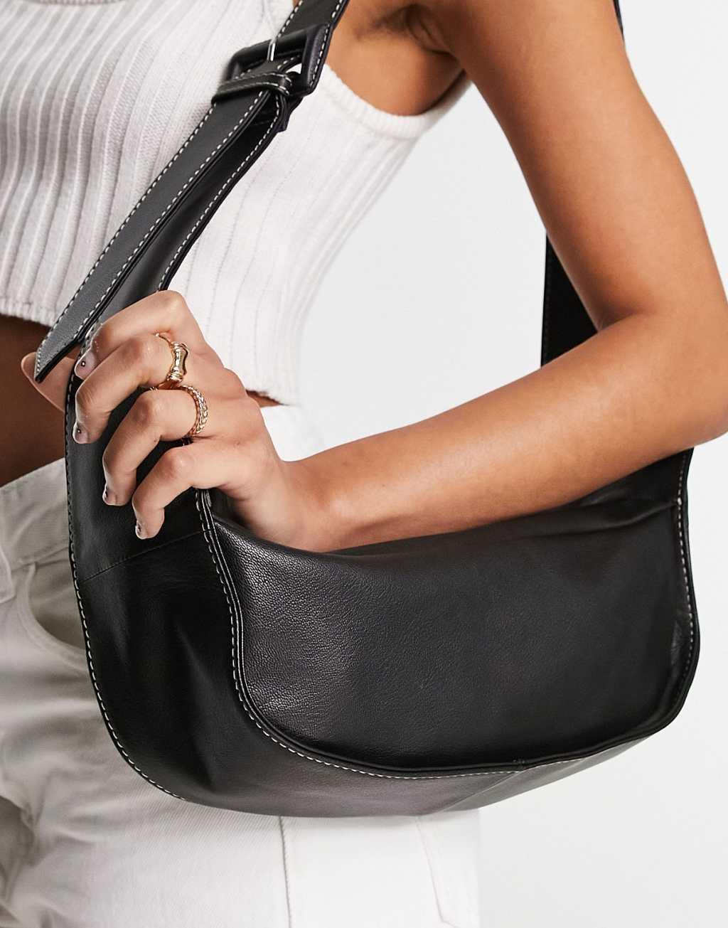 ASOS DESIGN leather curved base crossbody sling bag with contrast stitch in black Product Image