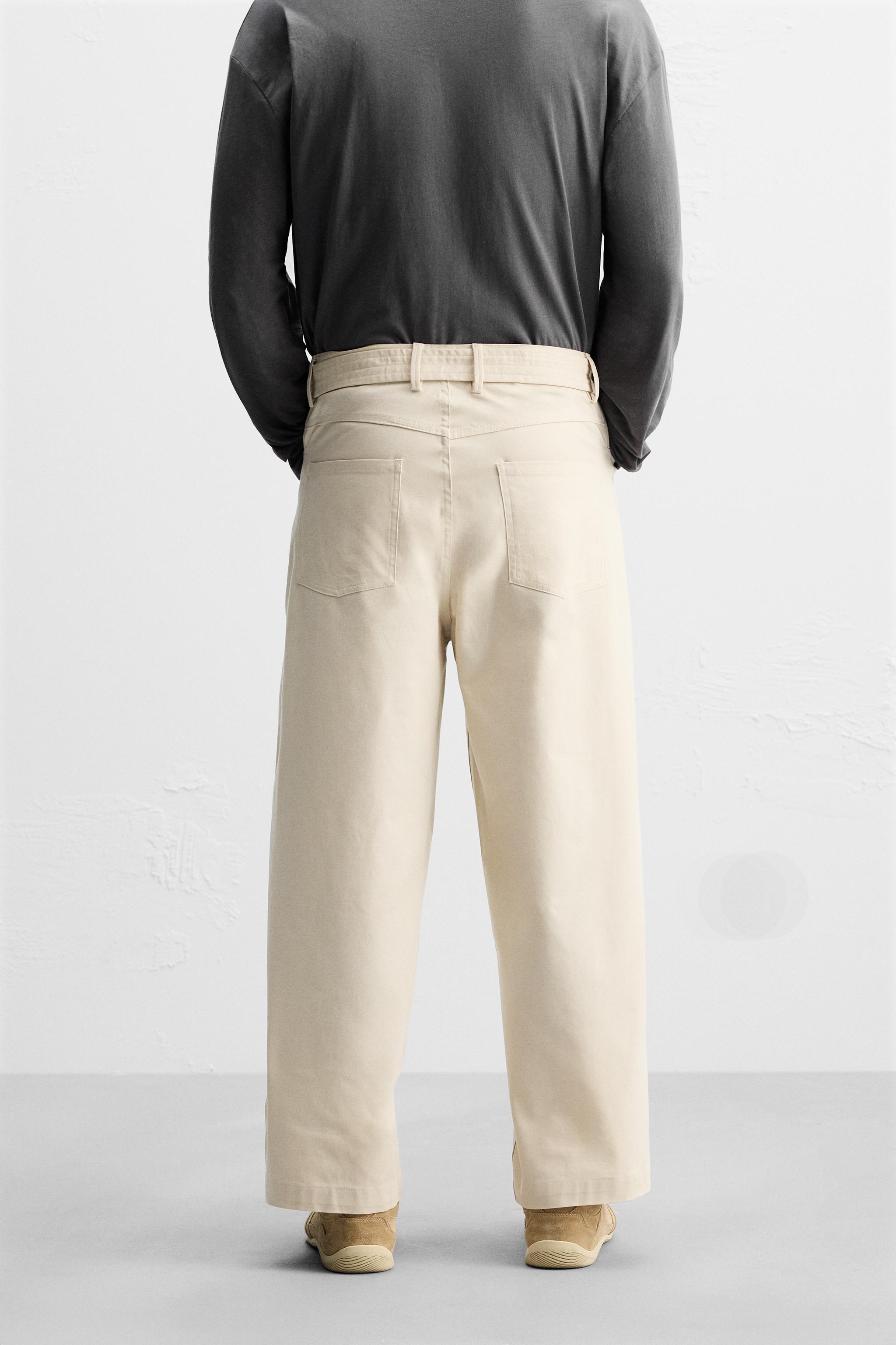 PLEATED PANTS WITH BELT Product Image