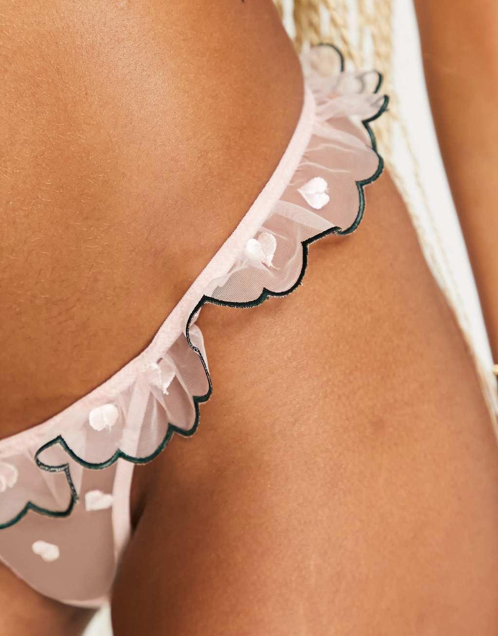 Lost Ink heart embroidered mesh dip front thong with frill trim in pink Product Image