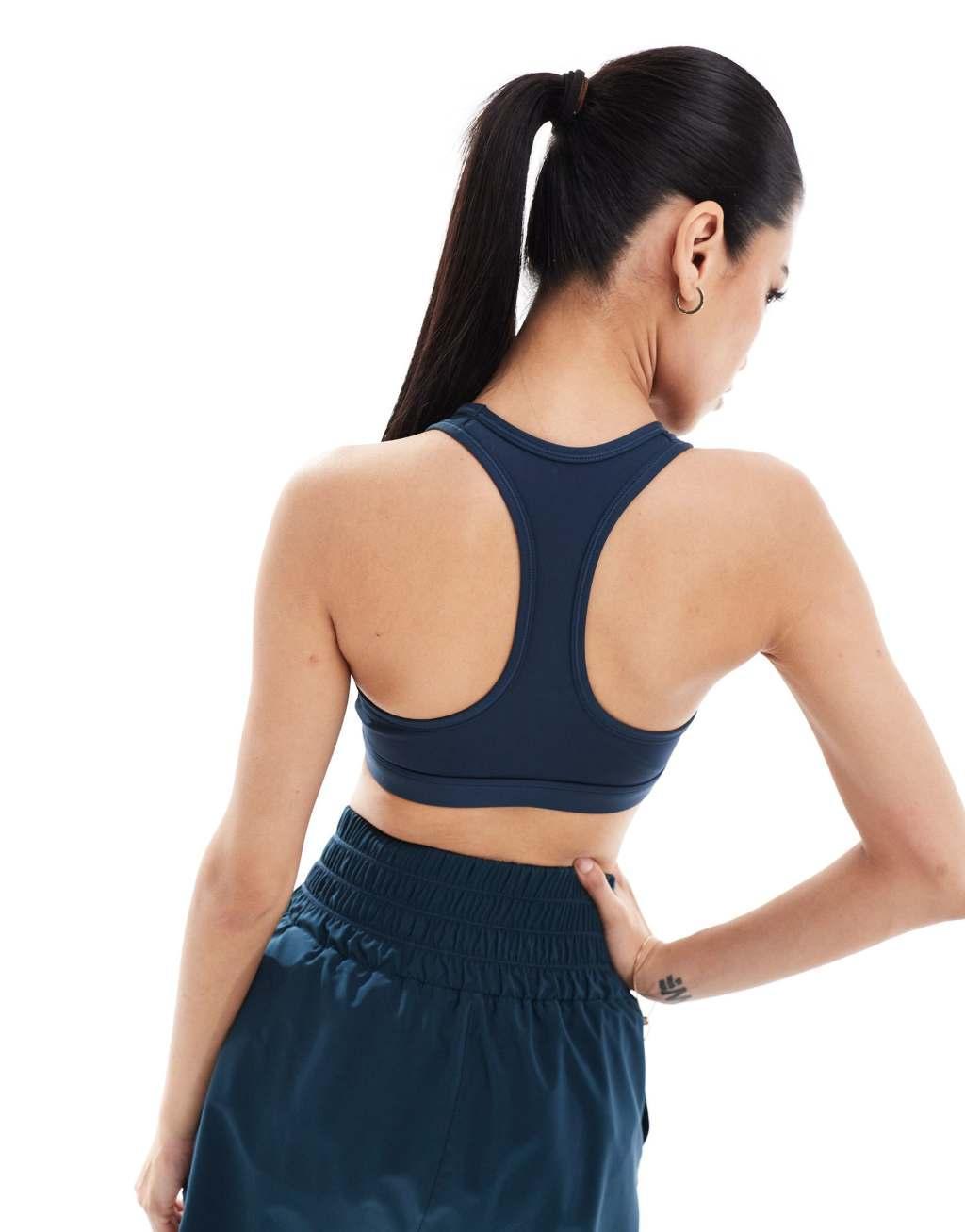 Nike Training Swoosh medium support sports bra in navy Product Image