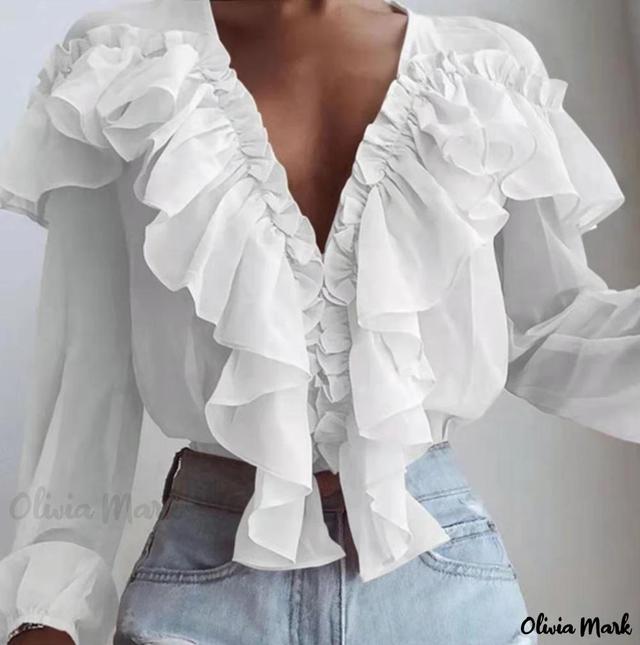 Olivia Mark – Deep V-Neck Blouse with Ruffle Hem and Tassel Detail Product Image