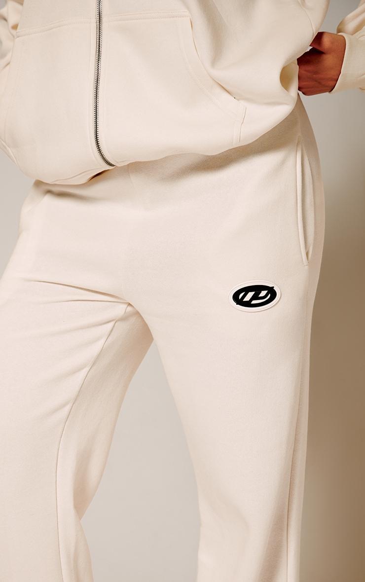 PRETTYLITTLETHING Cream Contrast Logo Badge Wide Leg Sweatpants product image