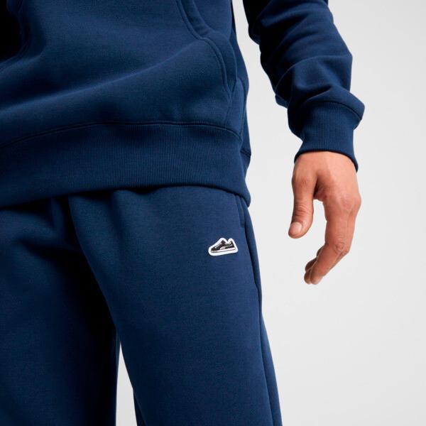 PUMA Suede Logo Men's Jogger Pants in Dark Blue Product Image