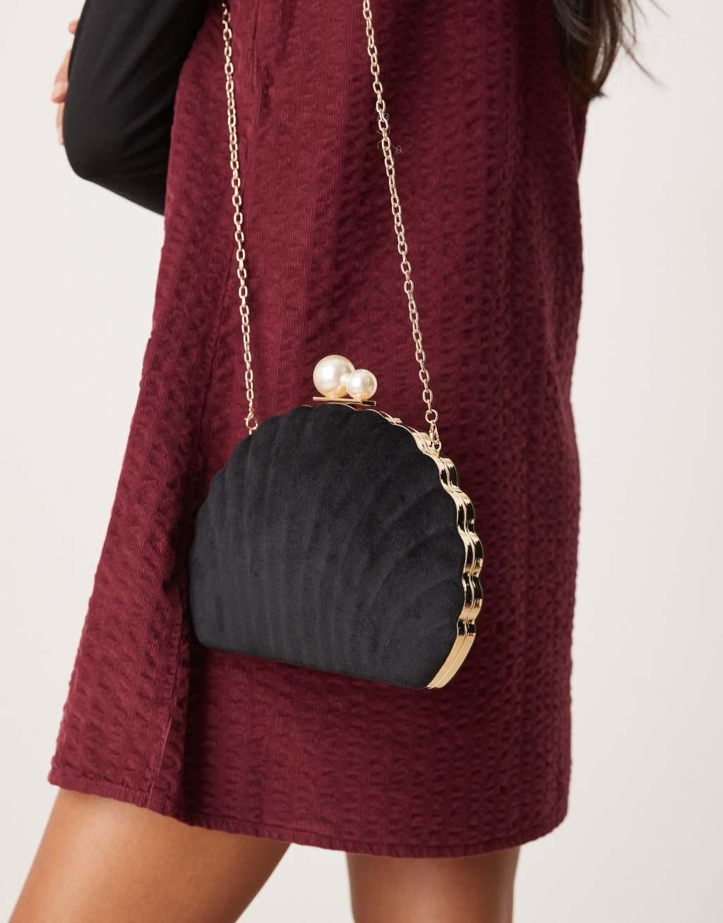 True Decadence velvet shell clutch bag with pearl clasp in black Product Image