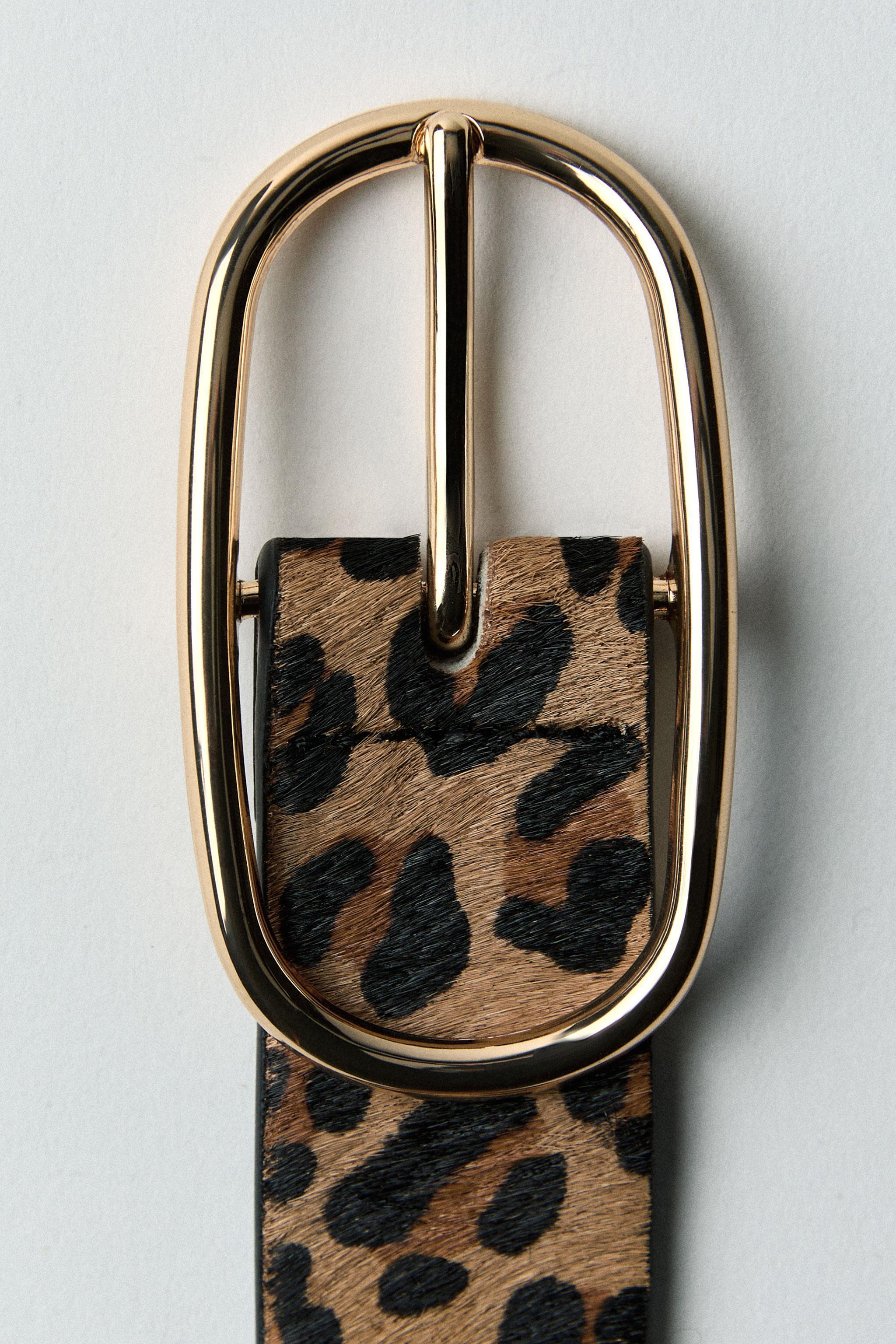 Belt made of printed leather with a width of 1.2 inches (3 cm). Oval metal buckle. Product Image