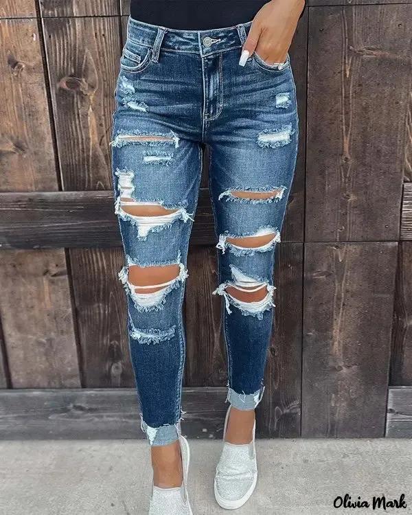 Olivia Mark – Jeans with ripped and cut pockets Product Image