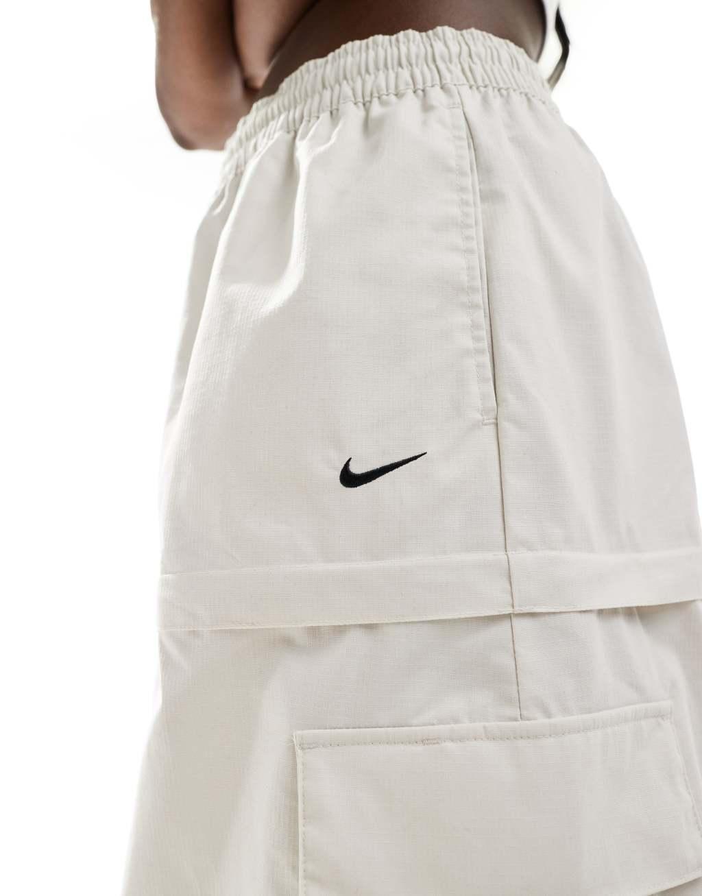 Nike Woven 2 n 1 maxi and mini skirt with zip detail in beige Product Image