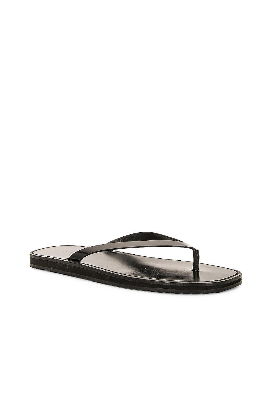 The Row City Flip Flop in Black - Black. Size 38.5 (also in 37.5, 38, 40). Product Image