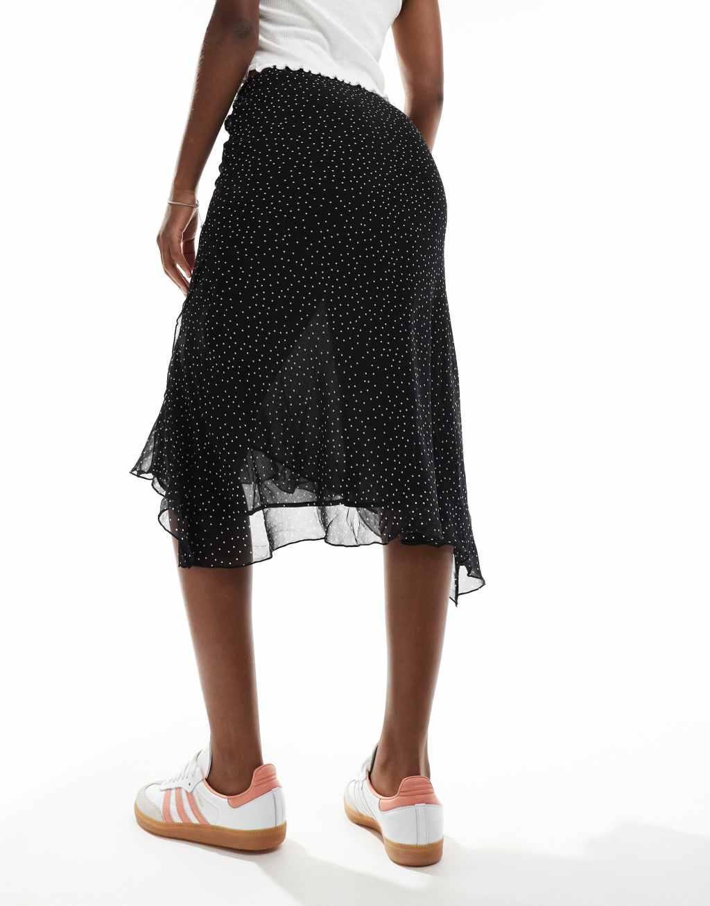 Mango asymmetric hem spot printed midi skirt in black Product Image