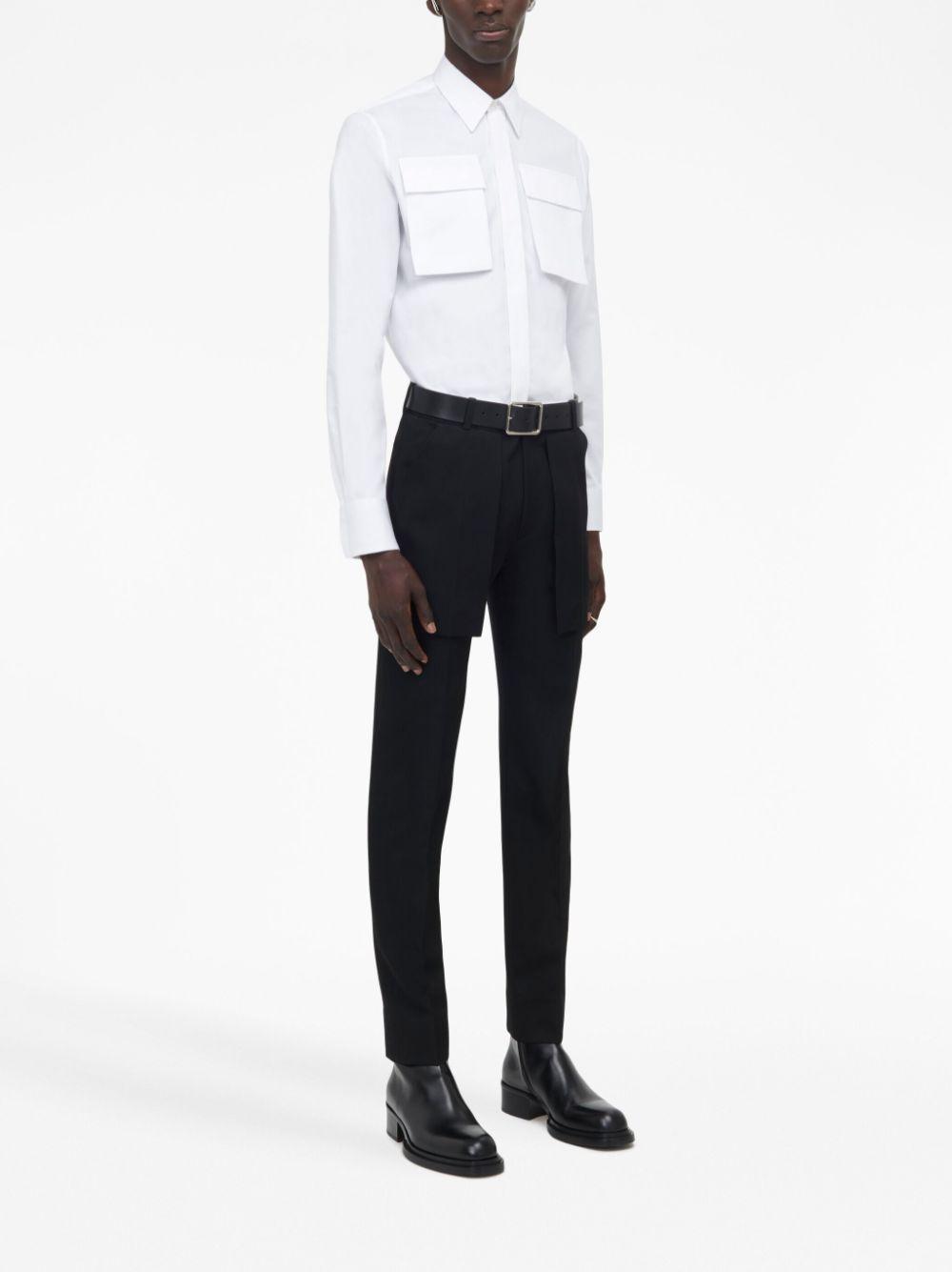 Exposed Pocket Trousers In Black Product Image