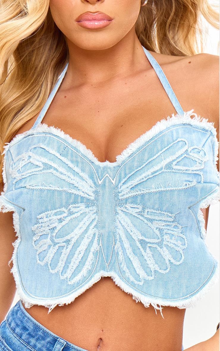 Light Blue Wash Raw Hem Butterfly Crop Top Product Image