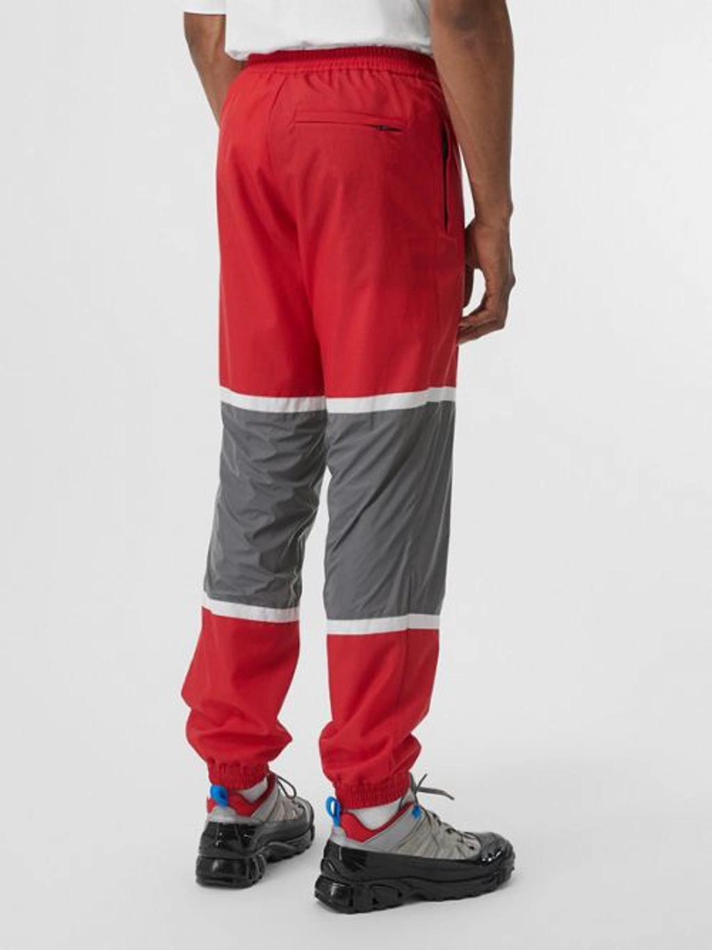 BURBERRY Logo Graphic Striped Nylon Trackpants In Red Product Image