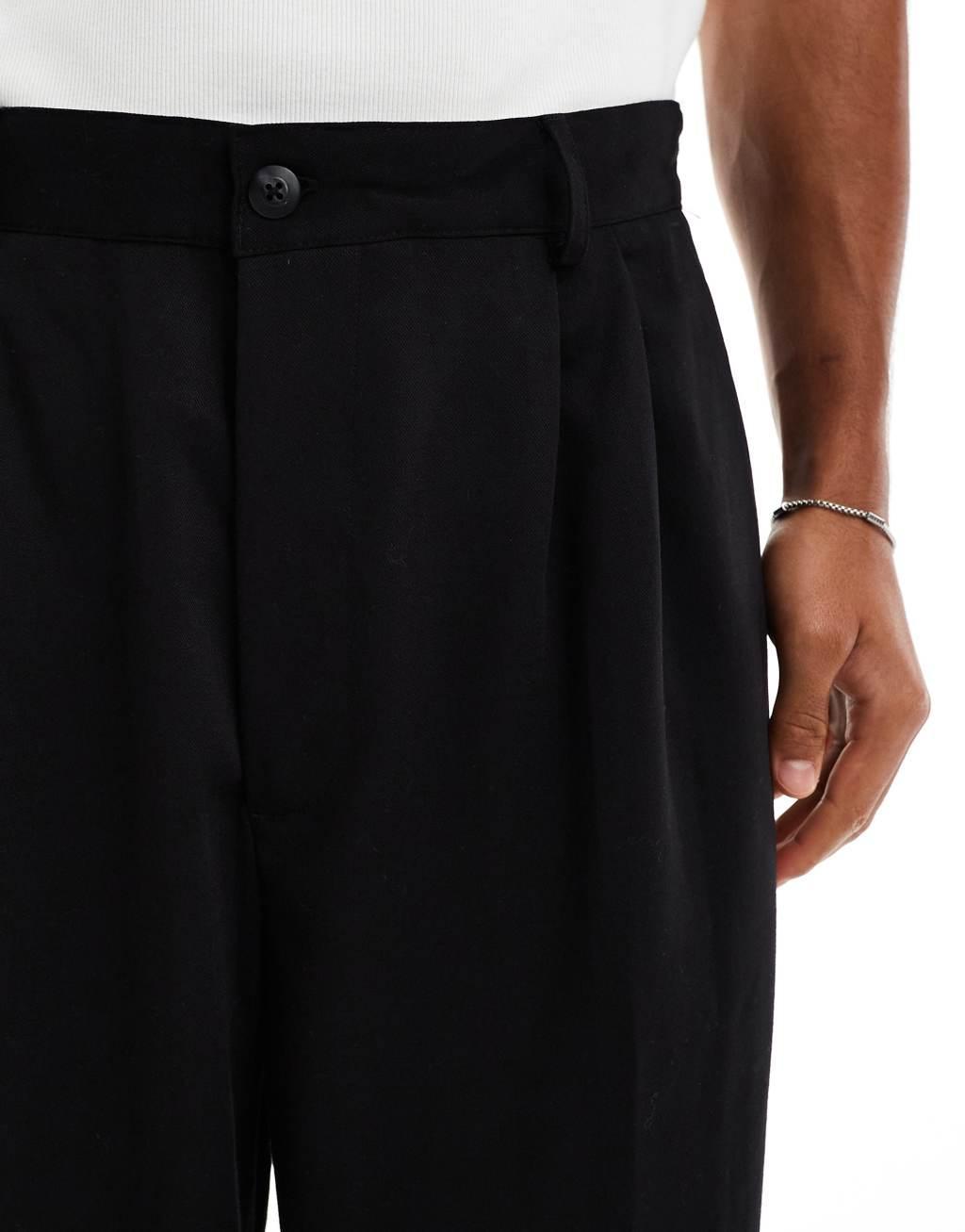 Bershka baggy tailored pants in black Product Image