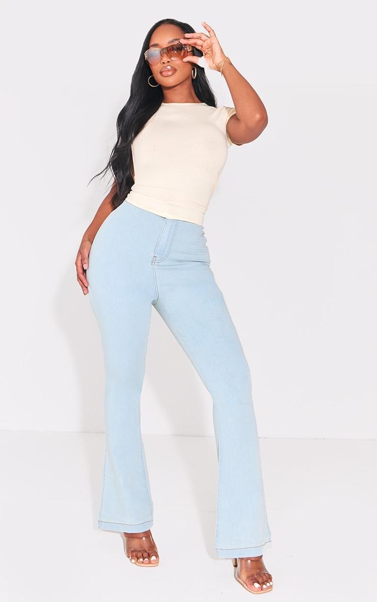 PRETTYLITTLETHING Shape Light Blue Wash Split Hem Detail Flared Jeans product image