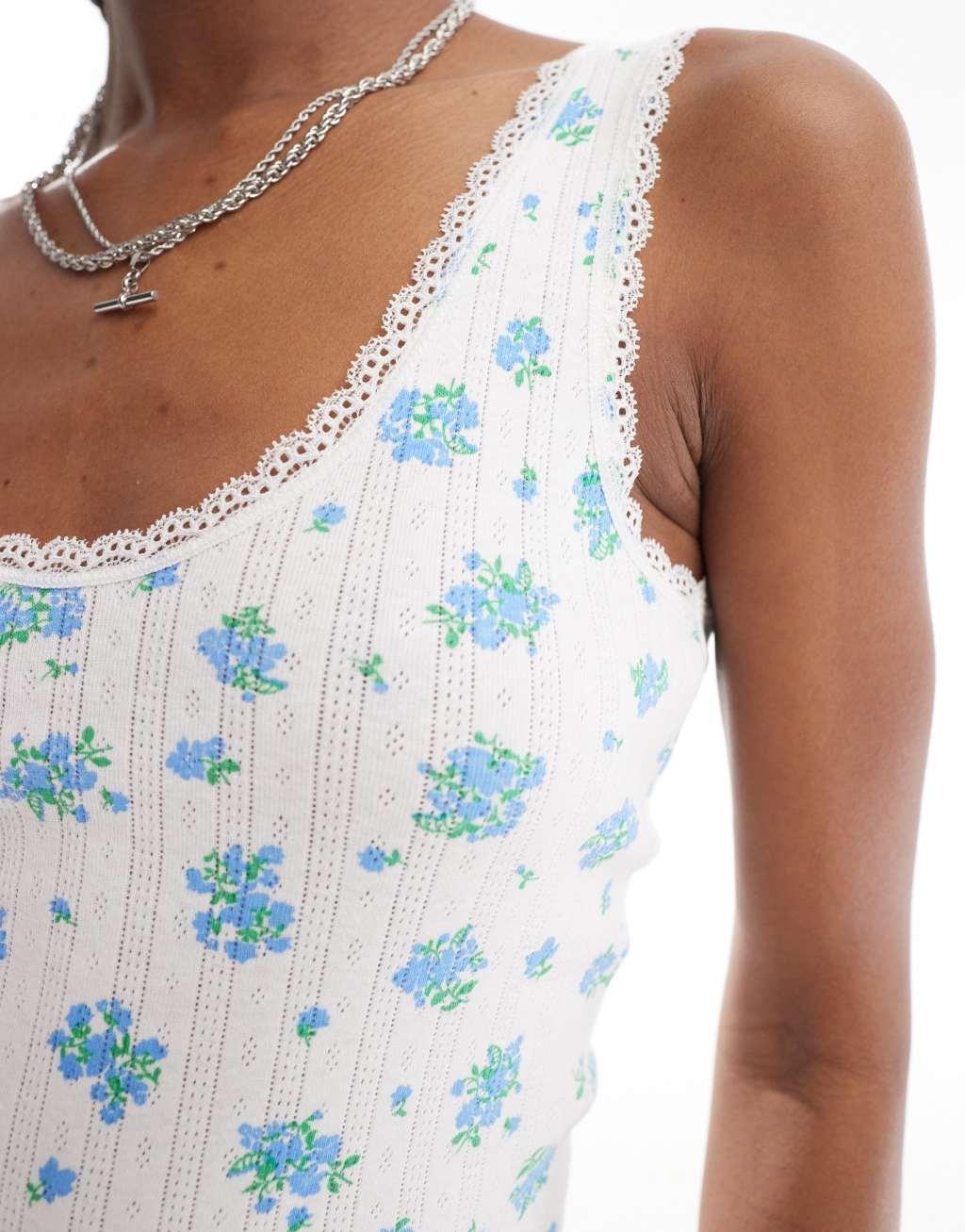 Monki pointelle scoop neck tank top with lace trim in off white and blue floral print Product Image