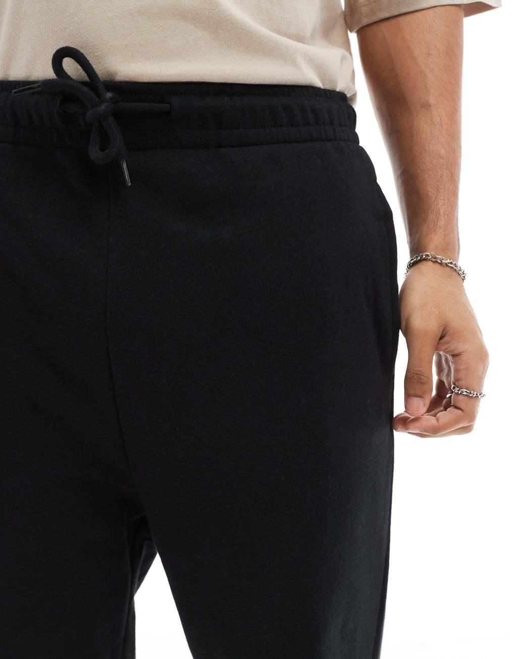 Jack & Jones loose cuffed sweatpants in black Product Image