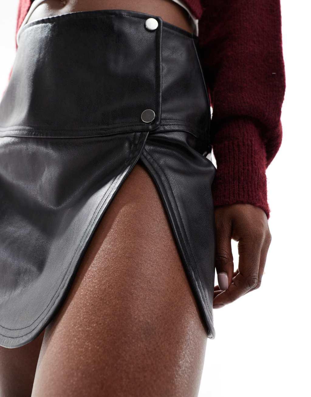 ASOS DESIGN snap detail leather look mini skirt in black Product Image