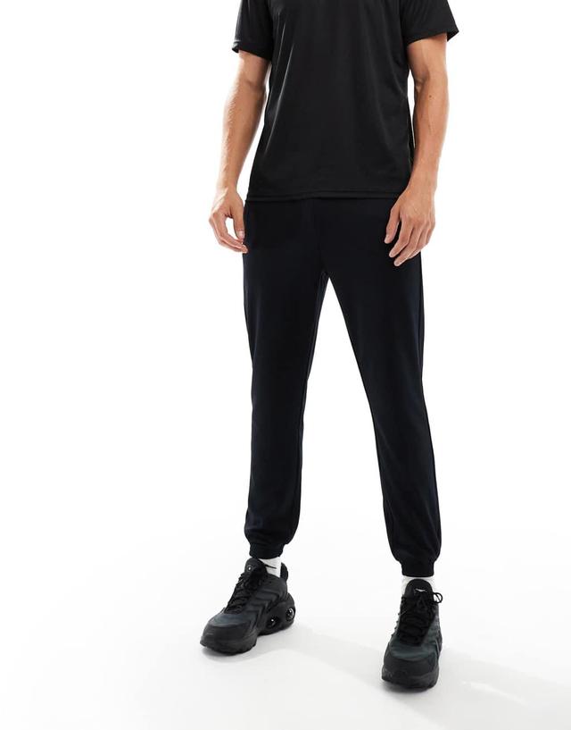 ASOS 4505 tapered thermal fleece lined running sweatpants with zip pockets in black Product Image