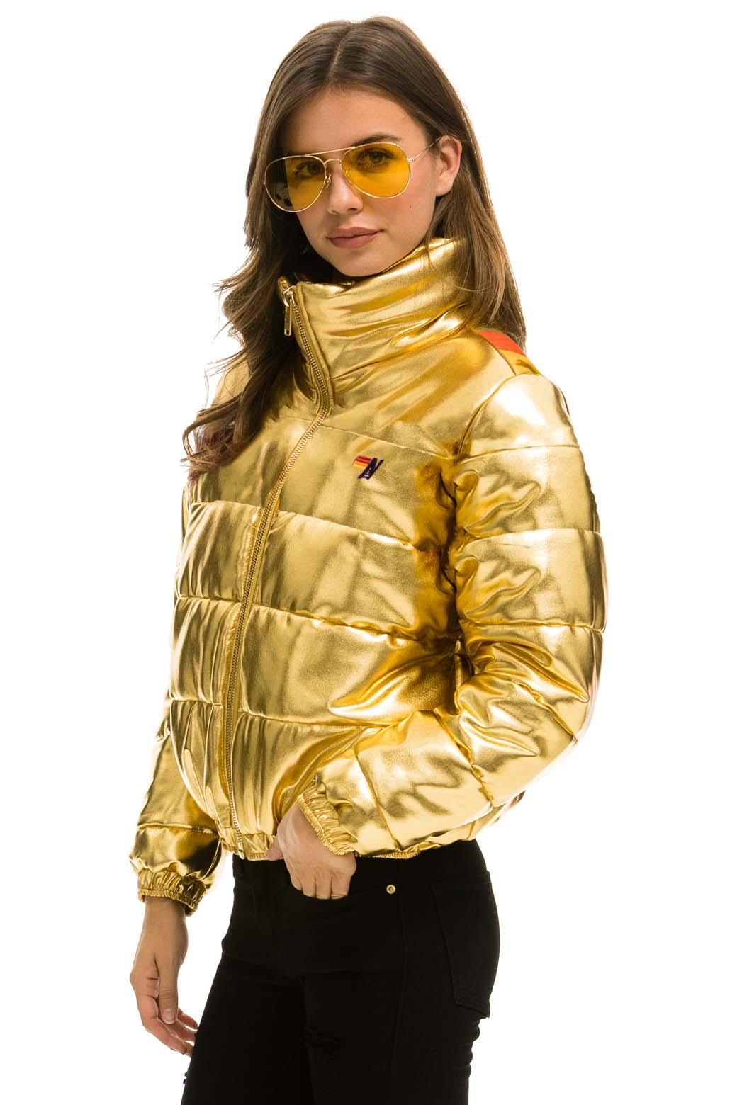 SUNBURST APRES PUFFER JACKET - GLOSSY GOLD Female Product Image