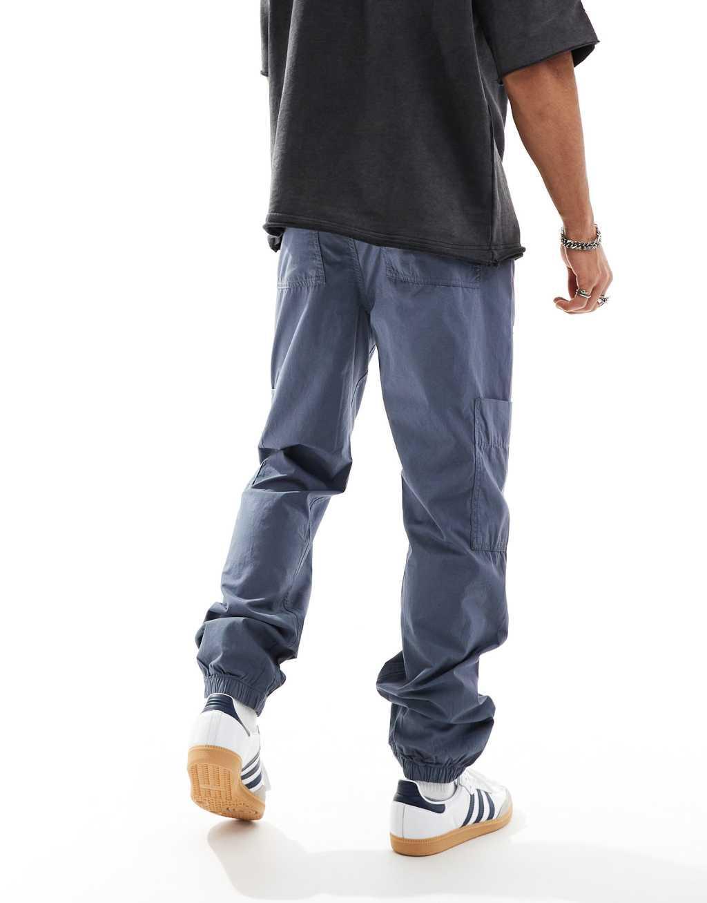 ASOS DESIGN pull on cargo sweatpants in blue Product Image